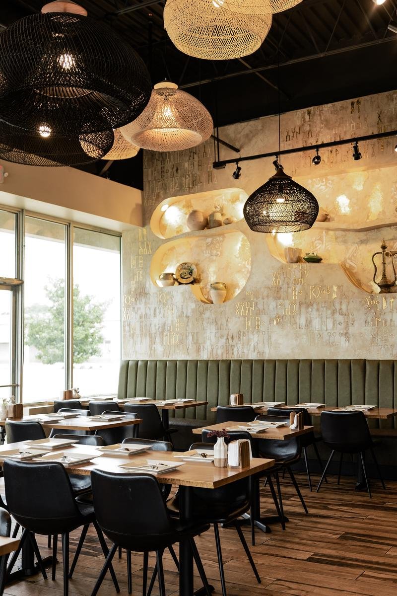 Warm hospitality environment and cozy seating at Sufra